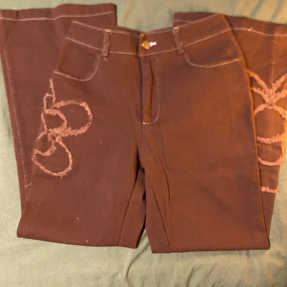 brown flare pants with flower design